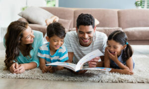 Mother and father use interactive read aloud book to entertain kids