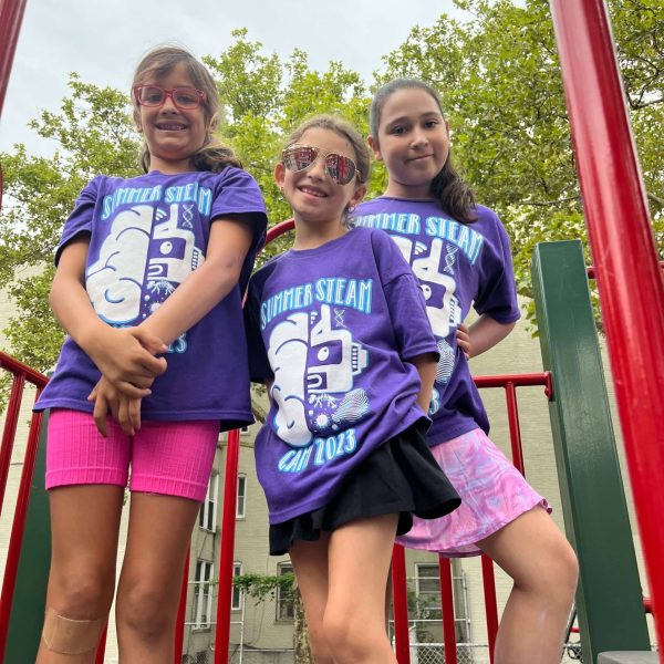 Children enjoying hands-on learning at Tip-Top Brain’s academic summer camp.
